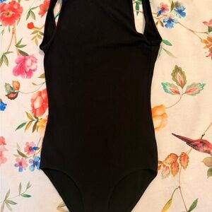 Black Sleeveless Bodysuit size XS
Elegant black sleeveless bodysuit.